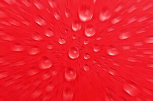 Top view of water droplets on red cover background with zoom effect. Suitable for wallpaper photo