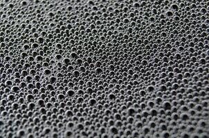 Top view of air bubbles trapped inside a gel-like transparent substance. photo