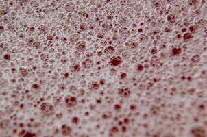 Top view of Macro shot of bubbles forming on a water surface photo