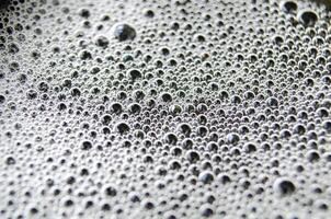 Close up view of bubbles on dark background with customizable space for text photo
