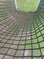 Climbing the Net at the Playground of playing. photo