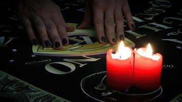 Playing Witchcraft Spiritual Halloween Game Ouija Board photo