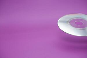 a compact disc isolated on purple background photo