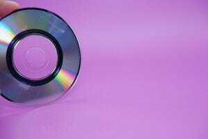 a compact disc isolated on purple background photo