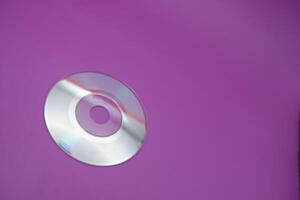 a compact disc isolated on purple background photo