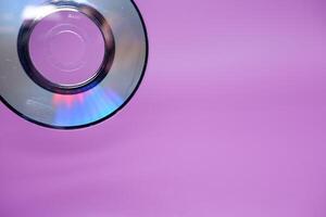 a compact disc isolated on purple background photo