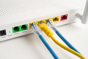 Ethernet cable with wireless router connect to internet service provider internet network. photo