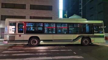 Kyoto, Japan on October 5, 2023. Hybrid Bus Kyoto, Bus Hino at night. T photo