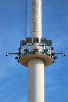 High Mast Lighting at the Plains of Merdeka Square. To illuminate visitors at night. Blue sky background. photo