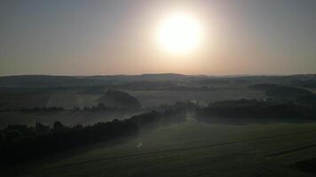 A view of the sun rising over a field video