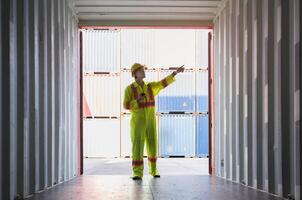 Foreman standing inside of empty container for inspection condition before loading goods. photo