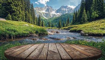 Round wooden table, mountain river flowing through a green mountain landscape, green meadows and snowy rocks background photo