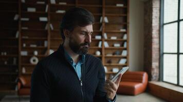 Dissatisfied middle aged Caucasian mature business man male businessman customer client speaking mobile phone call talk cellphone conversation irritated by bad connection low battery indoor apartment photo