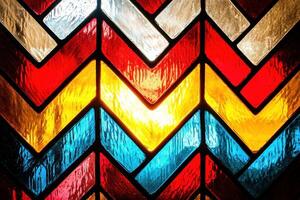 This stained glass design showcases a dynamic chevron pattern, with alternating colors that create a visually stunning interplay of light and texture, evoking a sense of movement and artistic elegance photo