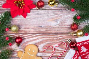 Festive background with Christmas decorations and spruce branches. Flatlay. Top view. Copy space. Selective focus. photo