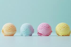 Four scoops of ice cream in vibrant colors rest on a clean, minimalist surface. The pastel hues create a delightful and inviting atmosphere, ideal for summer enjoyment. photo