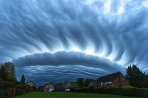 Dramatic storm clouds swirl over suburban houses creating an awe-inspiring sight during late afternoon hours photo