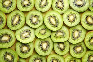 Freshly sliced kiwi fruit arranged in a vibrant pattern, showcasing their unique texture and color in natural light photo