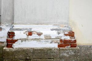 Fragment of the wall of an ancient temple with columns. Selective focus photo