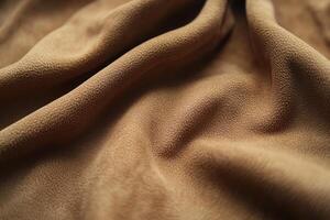 Soft brown fabric draping gracefully on a surface, capturing texture and warmth in natural light photo