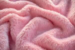 Soft pink faux fur blanket draped elegantly on a cozy couch during a warm afternoon photo