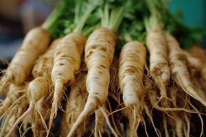 Freshly harvested ginseng roots laid out for sale at a local market in autumn photo