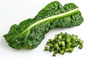 Freshly prepared Swiss chard leaf with diced green pieces arranged neatly on a clean surface photo