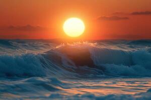 Vibrant sunset over ocean waves with golden hues reflecting on water at a tranquil beach photo
