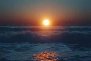 Spectacular sunset over the ocean waves, casting a warm glow on the water at twilight photo