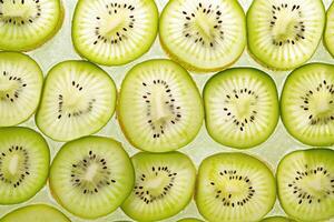 Sliced kiwifruit arranged neatly on a light surface for a fresh and vibrant display during midday photo