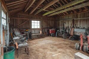 Well-maintained rustic barn interior showcasing agricultural tools and equipment on a sunny afternoon photo