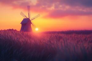 A picturesque windmill at sunset amidst golden fields, capturing the serene beauty of rural landscapes during twilight hours photo