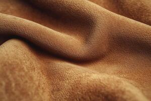 Soft brown suede fabric draped elegantly showcasing texture and color variations photo