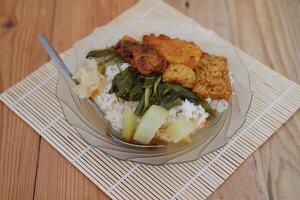 Nutritious plate of food featuring rice and assorted vegetables, a balanced and delicious dish photo