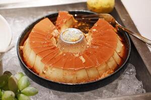 The pudding features a shiny caramel layer on top photo