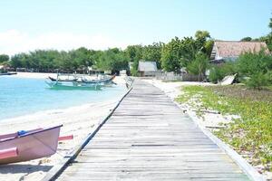 wooden boardwalk a pristine sandy beach photo