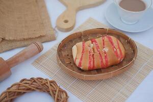 Strawberry bread with chocolate drink on white background photo