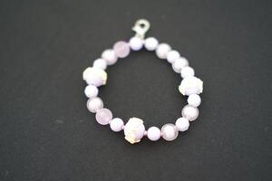 A beaded bracelet on a black surface. photo