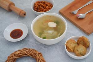 traditional Indonesian meal arranged neatly on a marble background photo