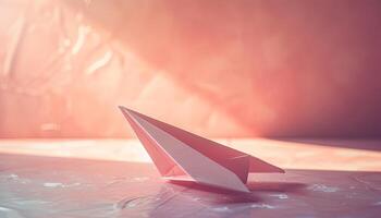 A paper airplane sitting on a table photo