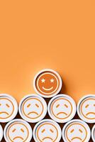 Vertical image of orange smiley emoticon shows very good satisfaction among dissatisfied emoticons on orange background. concept of evaluating service quality and customer opinions. photo