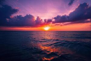 Vibrant Sunset Over Ocean with Dramatic Clouds photo