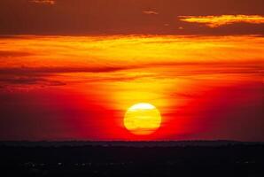 Fiery Sunset with Vivid Orange and Red Sky photo