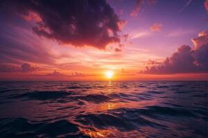 Vibrant Sunset Over Ocean with Dramatic Clouds photo