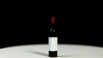 A bottle of wine sitting on a table video