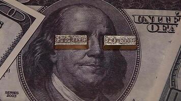 A close up of two dollar bills with a man's face on them video