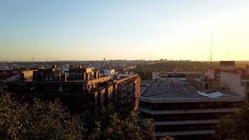The sun sets over a city skyline with buildings video