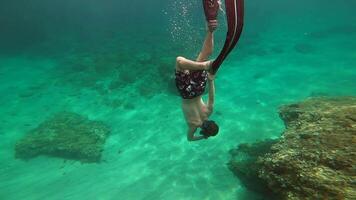A man is underwater with a snorkel video