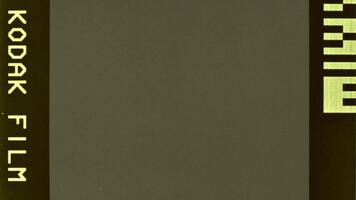 Dust, scratches, and grain texture create a distressed look on this old film surface. The dynamic film winding effect enhances the retro vibe, making it perfect for nostalgic film visuals. video