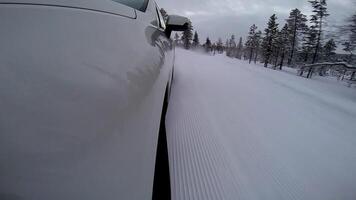 Side Of SUV Fast Driving On The Winter Road In The Forest video
